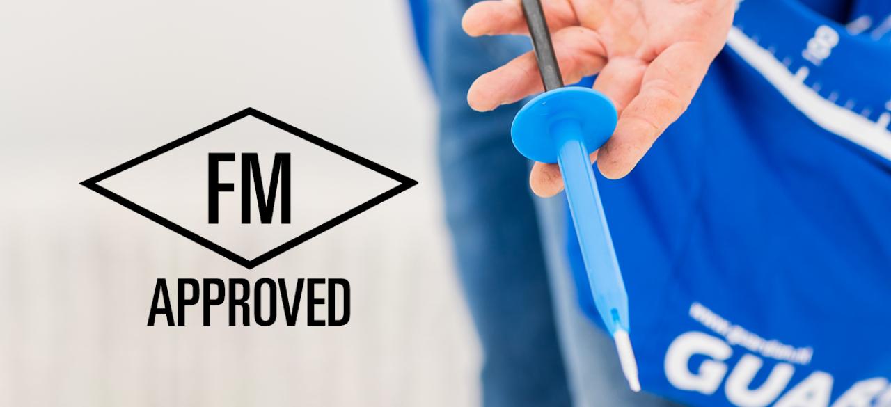 FM Approval. A man holds a Guardian R48 Tule. FM Approval Tule Guardian
